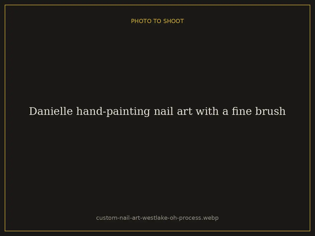 Danielle hand-painting nail art with a fine brush at Brazilian Nails By Danielle in Westlake, Ohio