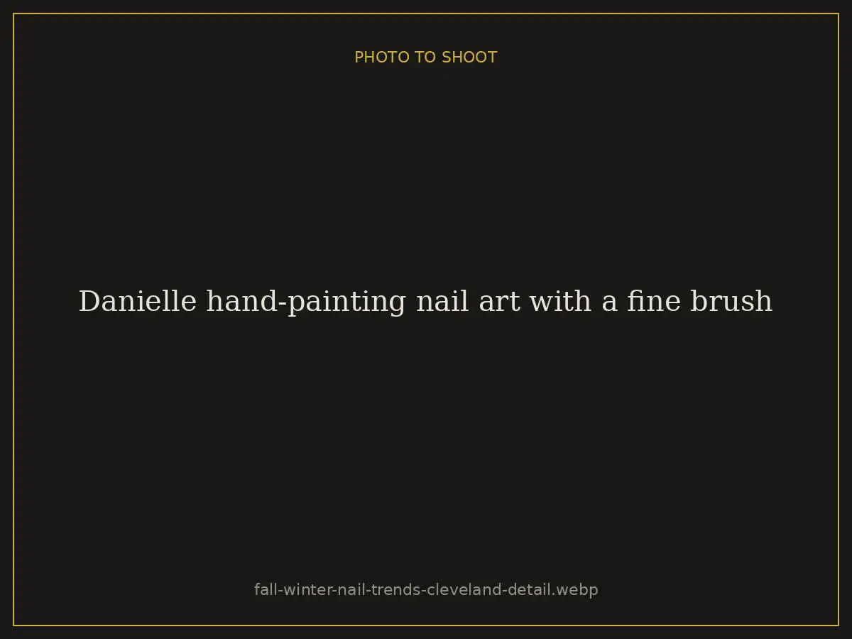 Danielle hand-painting nail art with a fine brush at Brazilian Nails By Danielle in Westlake, Ohio